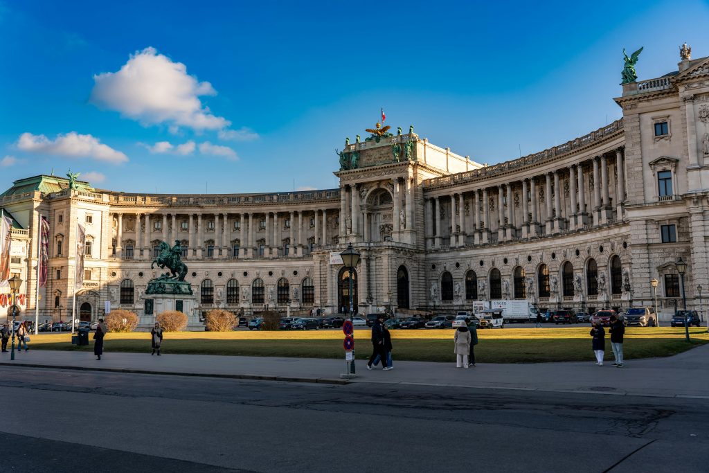 Elegant capture of the Hofburg Palace in Vienna, showcasing its grand architecture and vibrant atmosphere.